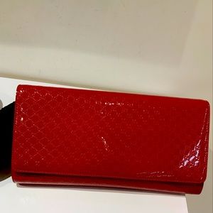 Gucci red authentic clutch. Comes with dust bag
